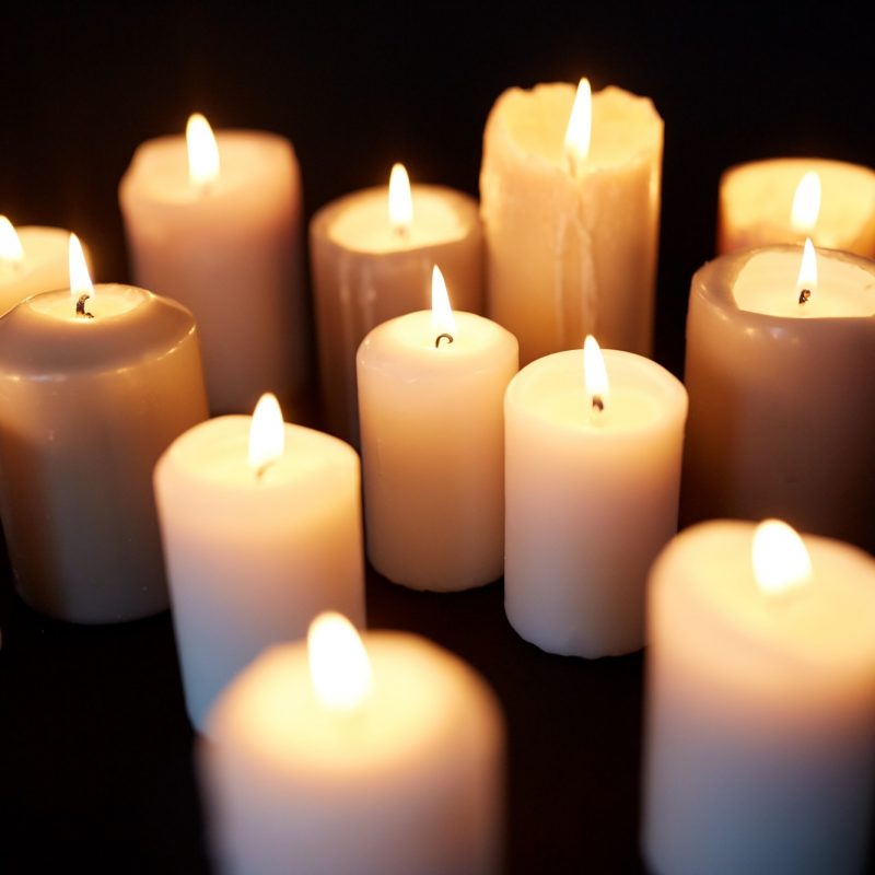 candles-burning-in-darkness-over-black-background.jpg